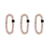 Trio of carame 100% mulberry silk skinny scrunchies by Silk Works, designed to reduce breakage and frizz.