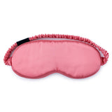 Watermelon pink mulberry silk sleep mask by Silk Works with soft ruched strap and discreet logo tag, designed for light blocking and skin comfort.