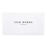 Silk Works London white luxury gift box with black logo, ideal for presenting silk sleep and self-care accessories.