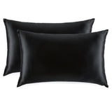 Pair of Silk Works 100% mulberry silk pillowcases in black, shown on a white background.