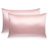Pair of Silk Works 100% mulberry silk pillowcases in pink, shown on a white background.