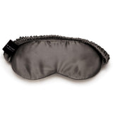 Charcoal grey mulberry silk sleep mask by Silk Works with soft ruched strap and discreet logo tag, designed for light blocking and skin comfort.