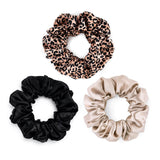 Set of 3 large mulberry silk scrunchies in caramel, leopard print, and black – soft, elegant, and perfect for minimizing hair damage and creating a gentle hold