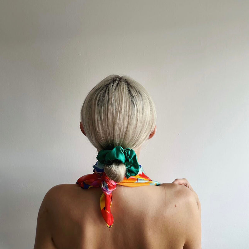 Lady with large green silk scrunchie in her hair