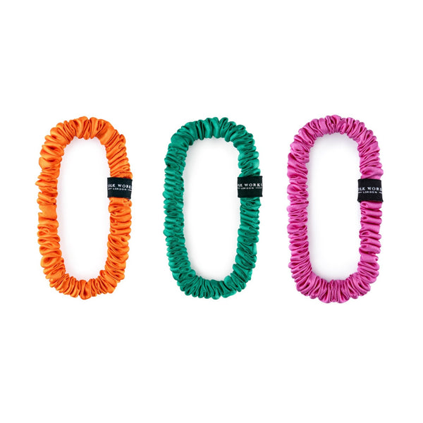 Three silk scrunchies in bright tropical colours.
