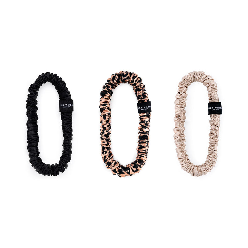Set of three Silk Works London mulberry silk skinny scrunchies in black, leopard print, and caramel – soft, smooth, and perfect for reducing hair breakage and creases.