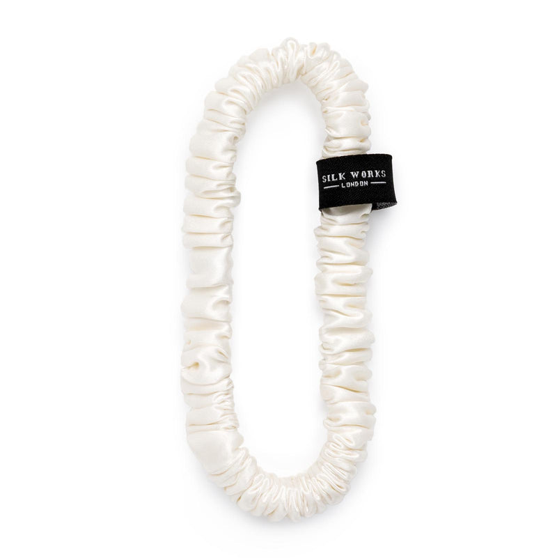 one silk skinny scrunchie in ivory by Silk Works London UK, with white background