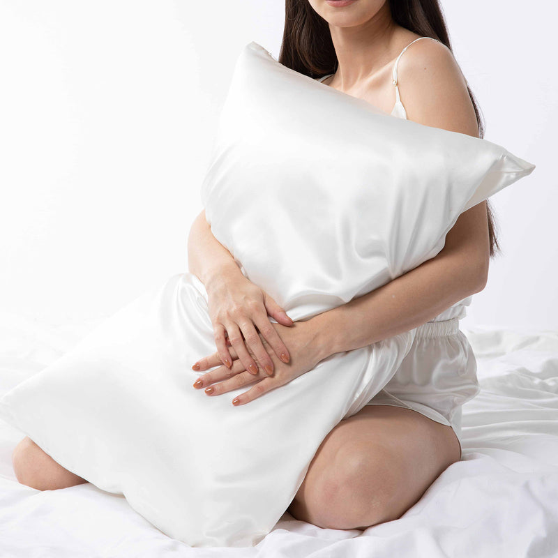 lady holding white mulberry silk pillowcase with zip closure