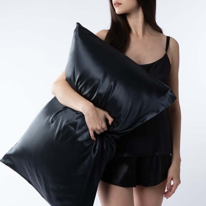lady holding black mulberry silk pillowcase